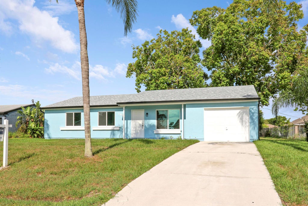 Photo of 1950 SE Carvalho Street, Port Saint Lucie, FL 34983 (MLS # R11069210)