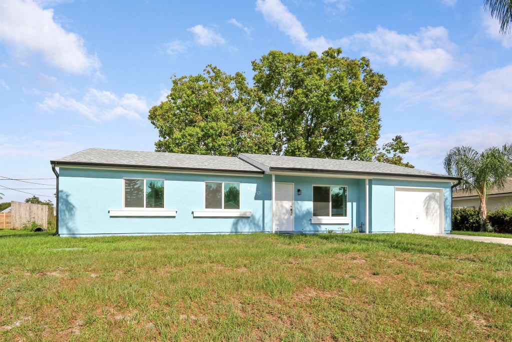 Photo of 1950 SE Carvalho Street, Port Saint Lucie, FL 34983 (MLS # R11069210)