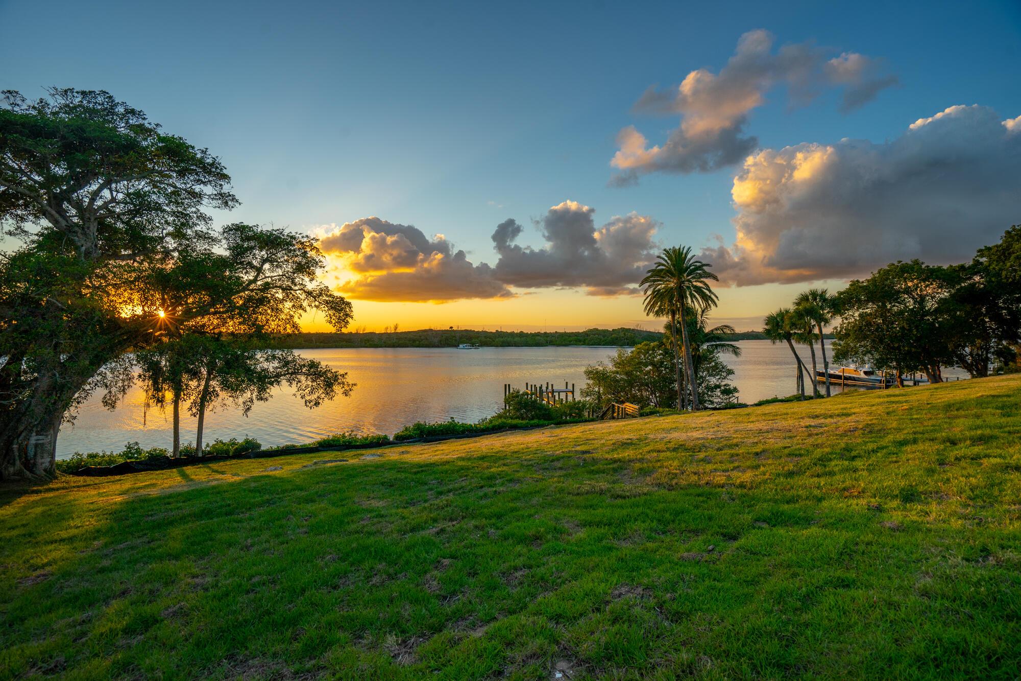 Once in a lifetime opportunity to build on 4.5 acres of prime waterfront land which includes a 10ft. wide private deeded beach access and parcel. This property is situated on one of Hobe Sound's highest elevations overlooking the Intracoastal Waterway. The land has unencumbered views of the nature preserve and is west facing providing magical sunsets. There is 366' of direct water frontage along with a new dock which can accommodate a large boat with a deep-water draw. Today, there is no other piece of property for sale that can compare to this. This parcel is completely secluded from its neighbors as the perimeter is filled with lush nature landscaping and beautiful mature trees. Allowed to build up to 3 structures on the property; total floor coverage not to exceed 17,400 sq ft.