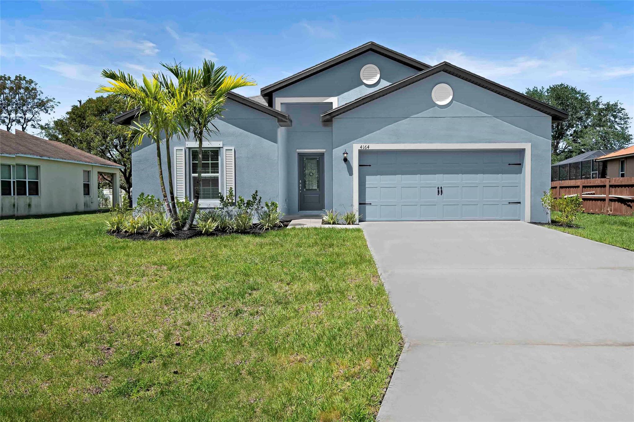 Ask us about our builder paid closing costs and no down payment options! Located within the highly sought-after area of Port St. Lucie, the Coral is more than move in
ready. This one-story home features an open-concept floor plan, 5 bedrooms and 3 full baths
complete with thousands of dollars’ in upgrades included. Features such as energy-efficient Whirlpool®
appliances, sprawling granite countertops in the kitchen, beautiful wood cabinets, brushed nickel
hardware and an attached two-car garage. The Coral also consists of a covered back patio, front yard
landscaping and a master suite complete with a massive walk-in closet. *Appliance models are subject to availability. **Exterior color scheme is as shown in first photo.