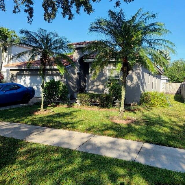 Photo of 4323 NW 44th Terrace, Coconut Creek, FL 33073 (MLS # B26042253)