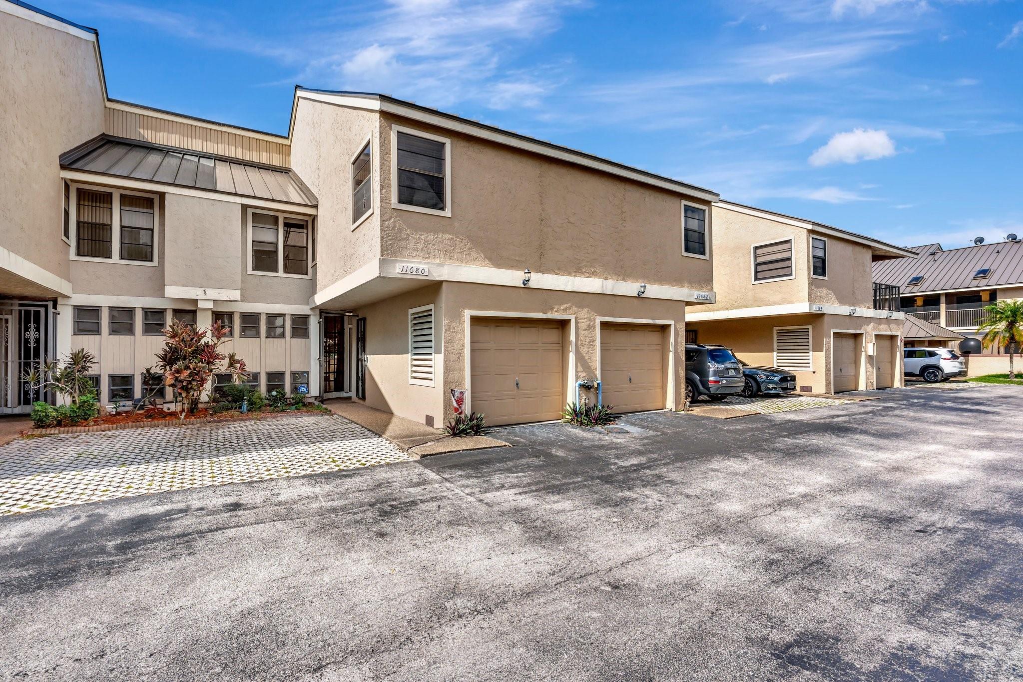 Cypress Run Townhomes. This 3/2.5 with 1 car garage is larger than others in this community at 1789 sq ft under air. You will appreciate the extra space for your family, as well as the back patio overlooking a big grassy field. Peace, Quiet, and Privacy really shine here. The primary bedroom has a balcony with the same view. The community has all new metal roofing. All assessments have been paid by the owner. AC is only 9 years old. All you have to do is fall in love, and move in. Eagle Ridge Park is just steps away. Perfect for your family and pets! Proximity to the night life of Coral Springs is plentiful. Dining and Entertainment options are numerous. Welcome home!