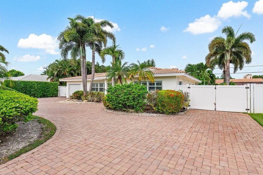 Welcome home to your piece paradise. Located in an "A" rated school district, this 3 bed 3 bath  pool home features an open floorplan with expansive windows and doors for natural light, an updated kitchen with shaker cabinets and quartz counters, a full house generator and water filtration system. All windows and doors have been updated to full hurricane/impact resistant. The large paved circular driveway provides ample parking for family and guests, and sided paved yard is perfect for boat storage. The main feature of this property is the expansive master suite with tray ceilings, large master walk in closet, master bathroom w/ his and her vanities, larger soaker tub, shower, and toilet closet. This home is located minutes to the beach and the best shopping and dining in Boca Raton.