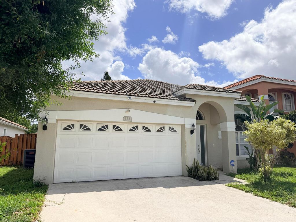Photo of 133 Woodlake Circle, Greenacres, FL 33463 (MLS # B26016518)