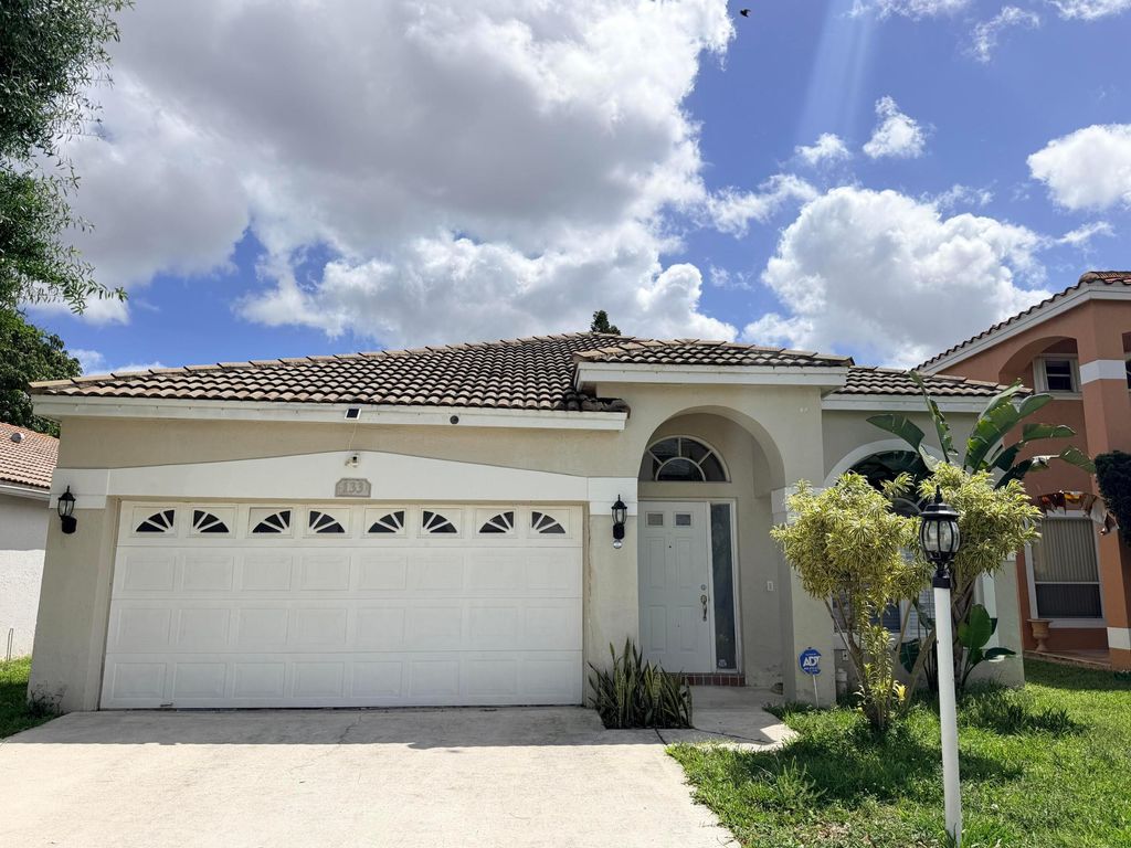 Photo of 133 Woodlake Circle, Greenacres, FL 33463 (MLS # B26016518)
