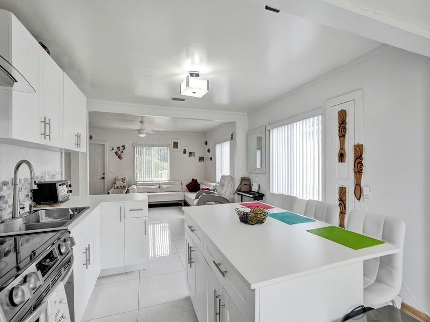 Perfect for First Time Homeowners or Investors looking to build! The property features a HUGE lot, providing ample space to extend the home or a pool, a secure spot for your boat or RV, or a beautifully landscaped yard for BBQs and gatherings many possibilities for whatever your vision may be!Stepping inside, and you'll find a spacious living room seamlessly flowing into the remodeled kitchen, complete with a breakfast bar. A brand-new washer and dryer set are ready for your laundry needs, and a versatile den area offers a perfect space for an office, that leads you to the oversized backyard. The kitchen and bathroom have been remodeled. Located in the heart of Hollywood, with easy access to major state roads and highways, top-notch shopping plazas, and entertainment hubs.
