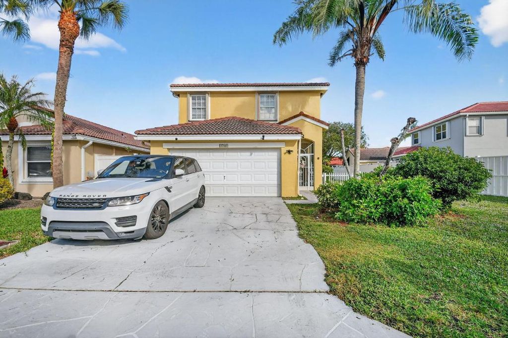 Photo of 7745 Springfield Lake Drive, Lake Worth, FL 33467 (MLS # R11149368)