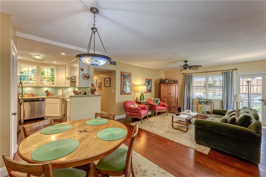 Corner unit on the second floor of well managed Manor Grove Phase II condo building "G".  Lovely bright unit has impact windows and doors.  Bamboo floors in the living areas and carpet in the bedrooms.  The open kitchen with granite counters.  This section permits one dog less than 20 lbs and cats OK.    Roofs resealed 3 years ago.  No washer/dryer in this unit BUT it is OK to install.  A/C condenser replaced on the roof in 2016.    No pending assessments, monthly fee is $425.  No renting first year of ownership.   Fully funded reserves in this building.  One assigned parking space with globs of Guest parking close by.