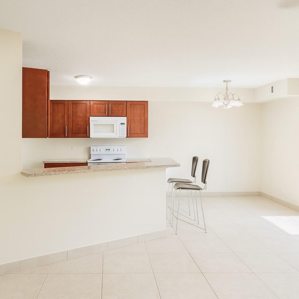 Beautifully maintained 2 bed / 2 bath first-floor unit with balcony. Upgraded kitchen with granite countertops, tile & parquet flooring, and newer A/C. Located in the highly desirable Summerbreeze community with pool, tennis, fitness center, playground, and more! Conveniently close to shopping, dining, major roads, and public transportation.