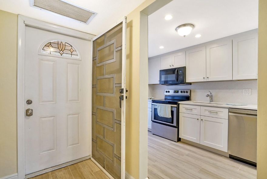 This remodeled 2-bed, 2-bath residence in the heart of Lighthouse Point is ready to be your new home. The unit features a tastefully updated kitchen with quartz countertops, porcelain plank flooring throughout, and an abundance of natural light. The bedroom layout offers comfortable separation and walk-in closets, while a screened patio overlooks the courtyard for a quiet outdoor retreat. Residents enjoy access to a heated pool, fitness center, and shuffleboard, along with a community dock offering ocean access for kayaks, paddleboards, and boat dockage when available. The community is adjacent to Dan Witt Park, walking distance to Packy’s Sports Bar and Papa’s Raw Bar, just minutes from Deerfield's Blue Wave Beach, and perfectly positioned to enjoy the best of Lighthouse Point living.