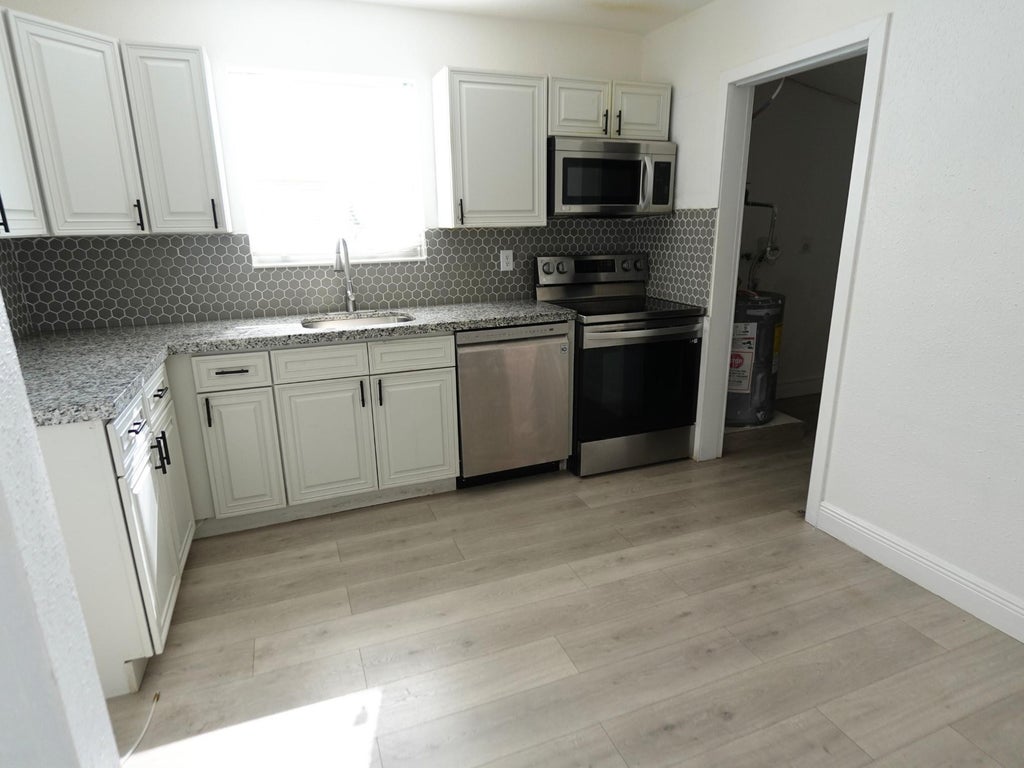 Photo of 4421 NW 34th Court, Lauderdale Lakes, FL 33319 (MLS # F10542760)