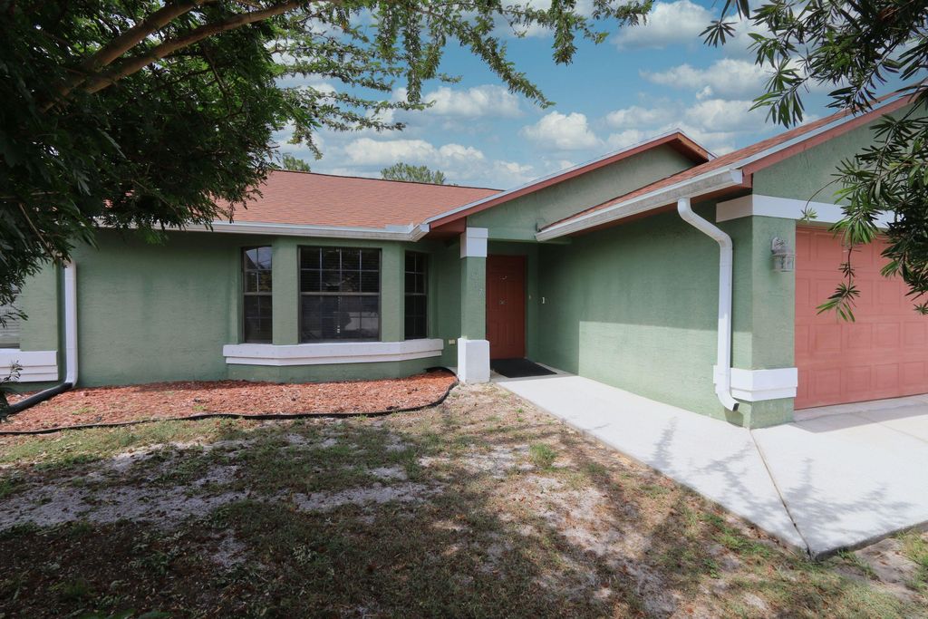Photo of 437 SW Dahled Avenue, Port Saint Lucie, FL 34953 (MLS # R10995481)