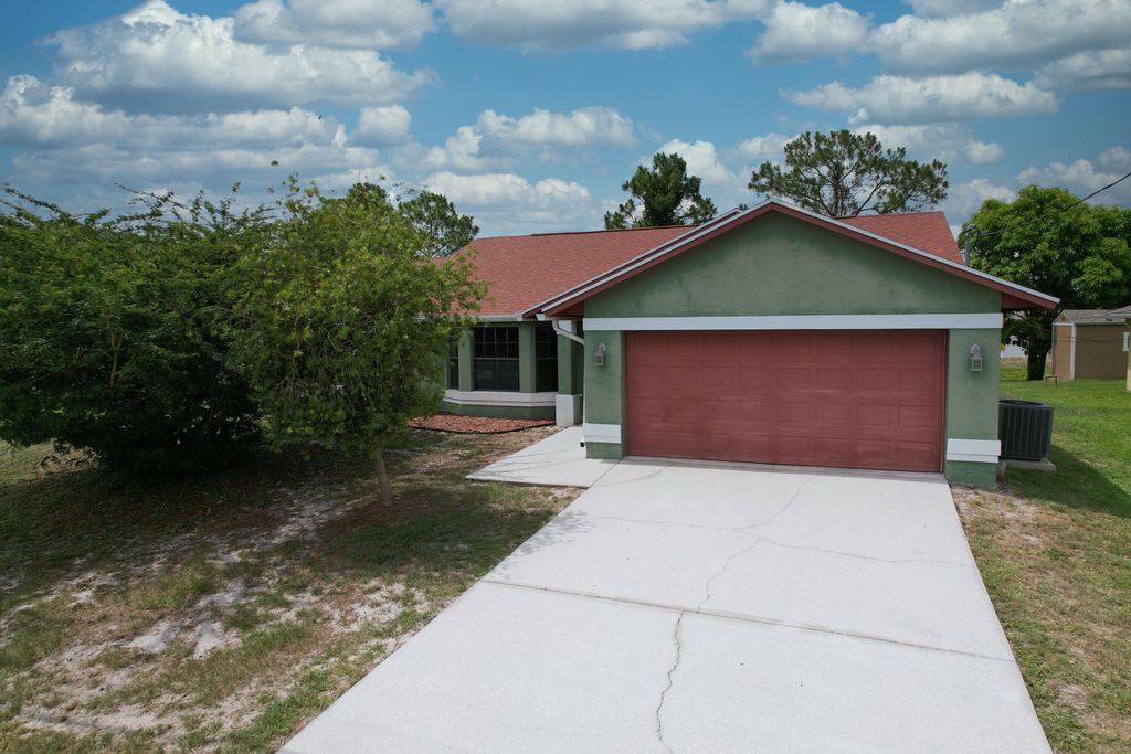 Photo of 437 SW Dahled Avenue, Port Saint Lucie, FL 34953 (MLS # R10995481)