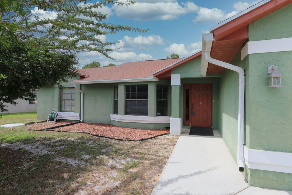 Photo of 437 SW Dahled Avenue, Port Saint Lucie, FL 34953 (MLS # R10995481)