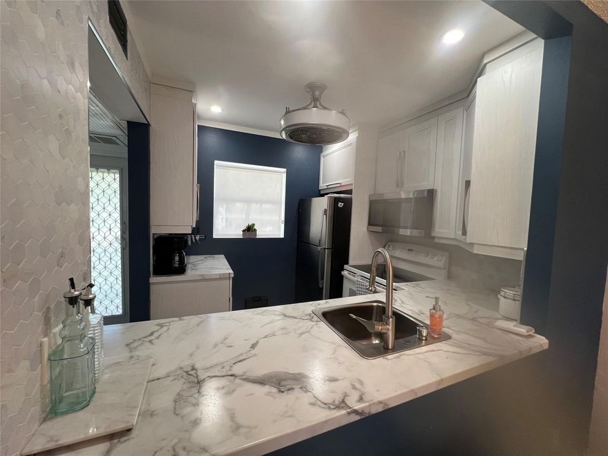 Tastefully Deluxe remodeled 1 bedroom, 1 bathroom condo in Hawaiian Gardens phase 6 in Nettle building. AC 2018, brand new water heater. Remodeled kitchen, updated bathroom, hard wood bamboo flooring in the dining room and living room, pergo flooring in the bedroom and every other room are tiles. Window in the Florida room have been updated, extra fridge in master. Roof 2022, fast internet is included in the monthly fee. Community has a nice club house with heated pool, BBQ and picnic area, shuffleboard, billiard, Petanque, exercise room and much more. Good location close to: restaurants, stores, highway, airport and about 25 min to the beach. This is a 55+ HOA will go dow $553 per month