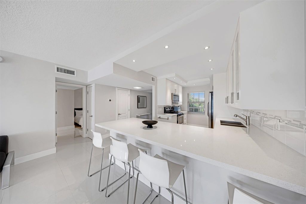 Photo of 4030 W Palm Aire Drive #406, Pompano Beach, FL 33069 (MLS # F10549637)