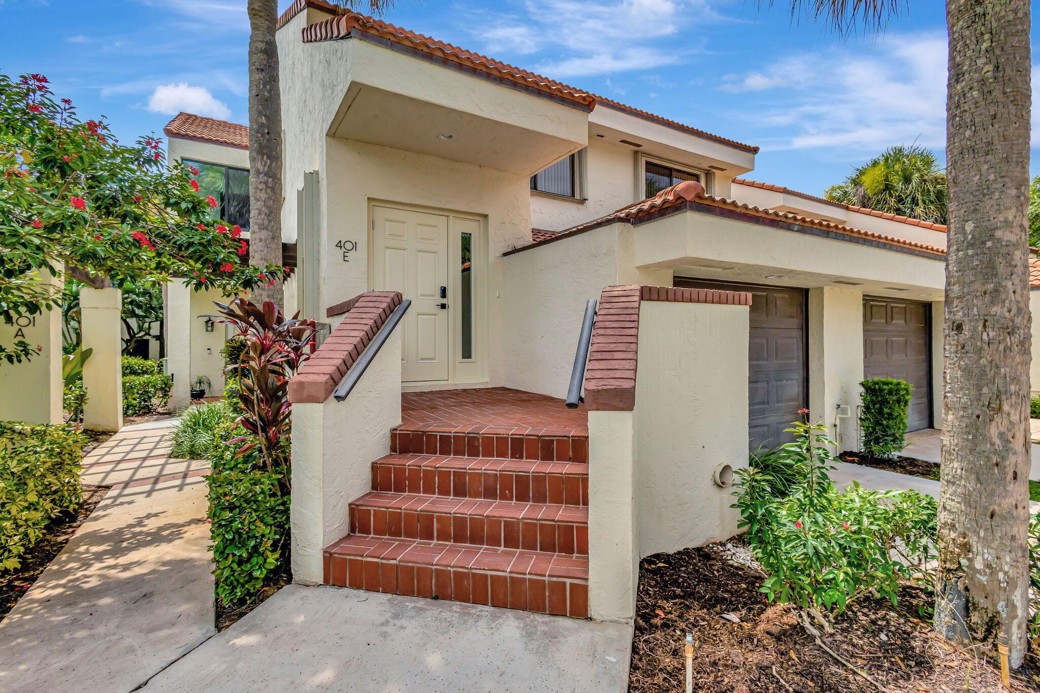 This stunning coastal contemporary home has just been completely updated for the discerning client. Lake and treetop views are amazing! Private, light-filled end unit is a short walk to the beach, restaurants and shopping. Features 3 bedrooms, 2 baths, and a 1-car garage as well as a huge terrace overlooking oaks and a lake/fountain. Luxury plank flooring throughout in a cool whitewash oak style. Open concept kitchen boasts a massive quartz counter/bar, French door refrigerator, convection oven/micro/air fryer, all stainless-steel appliances. Additional features include all LED lighting, new fixtures and fans, impact glass or storm shutters on all openings, an updated electrical panel, a/c hot water heater 2021, and all new PEX plumbing. Sea Oats offers a community room, pool.
