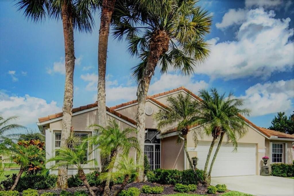 Photo of 148 Egret Circle Cir, Lake Worth Beach, FL 33449 (MLS # R10697387)