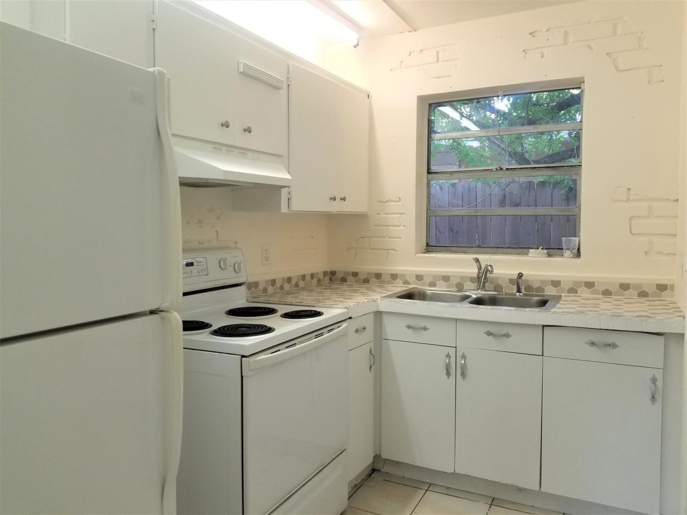 Freshly Painted 2 Bedroom / 1 Bath Duplex unit with Beautiful In-ground Pool & Large Shared Backyard. NEW Blinds throughout, Tile throughout entire unit, NEW Ceiling fans. NEWER Roof & A/C Unit; 4 yrs. Full-Size Washer & Dryer, Front parking. Rent includes water, trash, sewer, Pool & Lawn Service. *Ready to move-in conditions* Fast Approval* Close to I-95, Shopping Centers, Near Bus transportation and 15 mins to Relaxing Beaches. Don't miss out and schedule a viewing today!