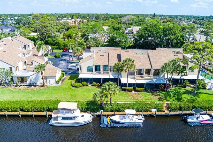 Highly sought-after waterfront community offering ocean access for boaters. This fully updated 3 Bed 3 Full Bathroom residence delivers the perfect blend of style and function. Featuring sleek vinyl flooring throughtout, beautifully upgraded kitchen with soft-close cabinetry, fully updated 3 bathrooms, convenient first-floor full bedroom and bath. 2021 roof, new 1-car garage door, partial hurricane windows & sliding glass door updates. Fully screened in rear lanai overlooking an amazing view that is a must see in person. Enjoy your own dock access with room for up to a 30-foot boat, potential for an Elevator Boat Lift-ideal for serious boaters. Pet-friendly, this is a rare opportunity to secure prime waterfront living in Sandpiper Bay Just a short drive to Downtown Stuart & All Attractions
