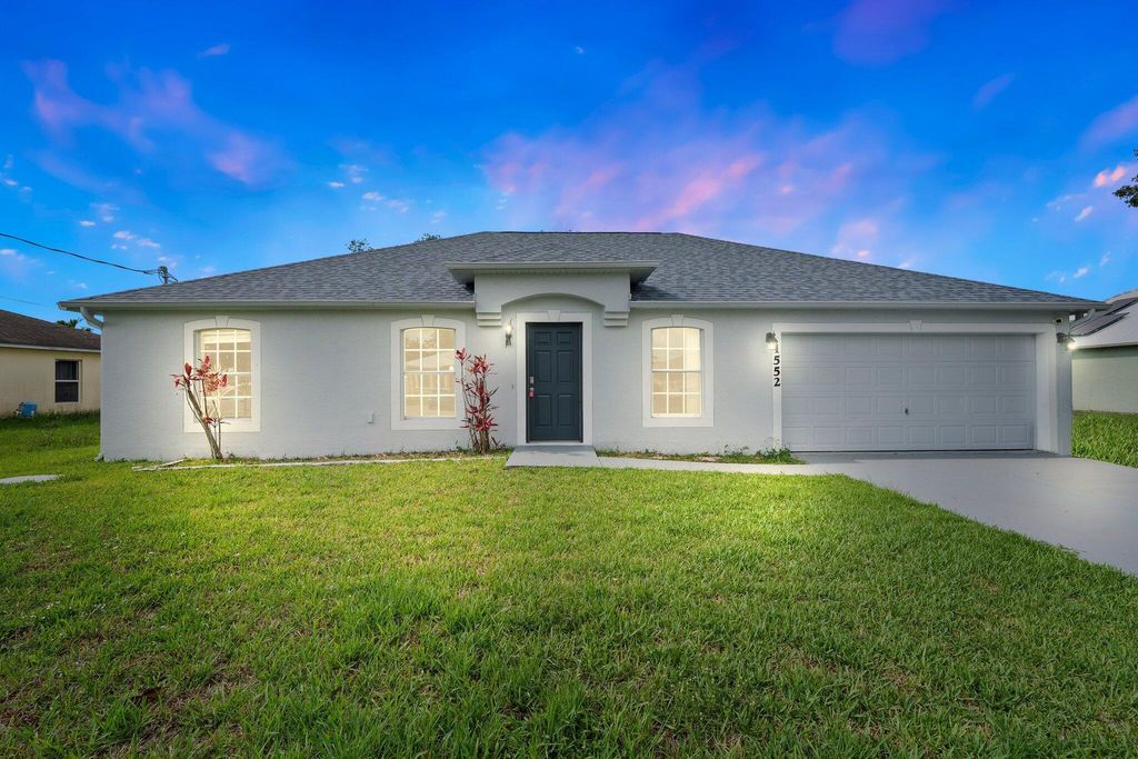 Photo of 1552 SW Neponset Road, Port Saint Lucie, FL 34953 (MLS # R11095722)