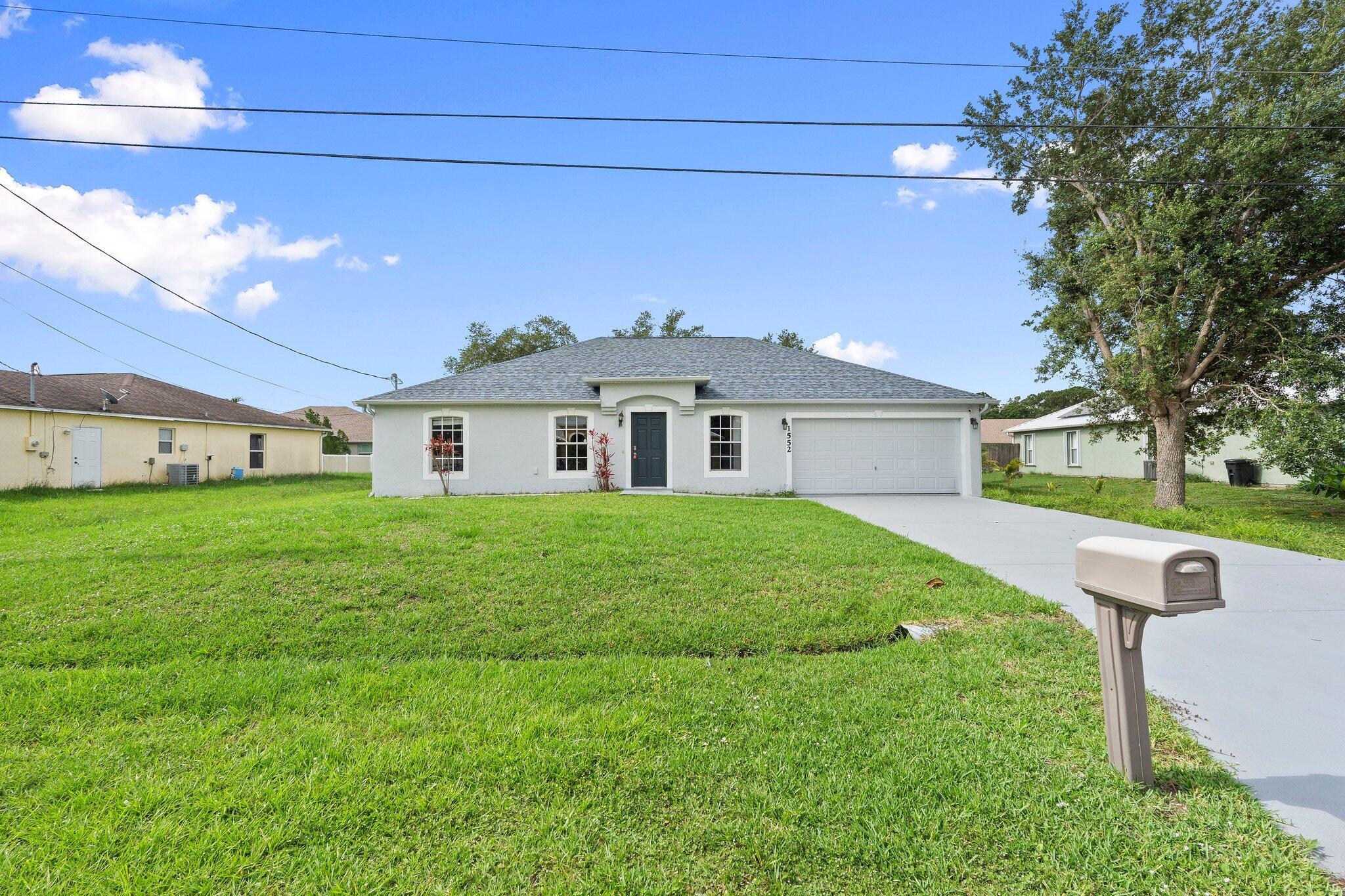 Beautiful 4-bedroom, 2-bath home in a highly sought-after area of Port St. Lucie! This move-in ready home features a newer roof, open-concept layout, and gorgeous wood-look floors throughout. The kitchen offers rich wood cabinetry, granite counters, and stainless steel appliances. Enjoy natural light, vaulted ceilings, and a spacious screened-in patio overlooking the backyard. Close to parks, schools, shopping, and dining -- this is the perfect place to call home!