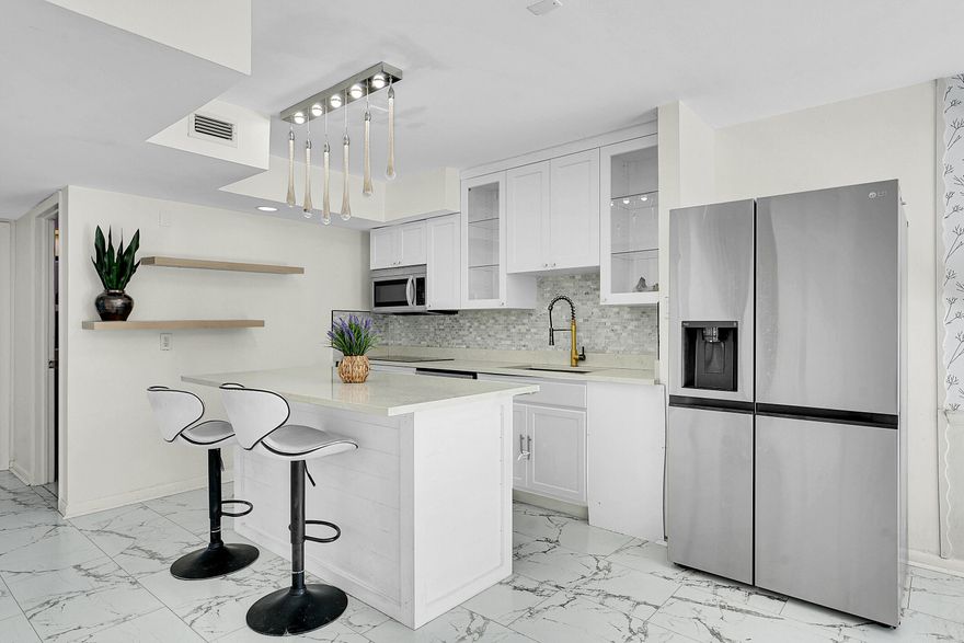 LOWEST PRICED, TRUE 3 Bedroom, 2 Bathroom home with No HOA in Palm Beach Gardens! This beautifully updated home features a modern kitchen, renovated bathrooms, and stylish flooring throughout. Light& bright with soaring ceilings.  Enjoy outdoor living with a covered patio, fully fenced backyard spacious enough for a pool, pets, or entertaining and a charming private, courtyard enclosed by a white picket fence. The large driveway accommodates 4+ vehicles, including trucks, boats, RV. Additional highlights include a 2021 roof, new A/C (2023), LG stainless steel Appliances (2023) and a convenient main-floor bedroom with updated lighting& flooring perfect for guests or a home office. Fantastic location, Top Rated Schools and Minutes to I-95, Turnpike, Restaurants& Shopping! Located in top-rated school district close to airports, major highways, restaurants, shopping, and entertainment, this home offers both convenience and freedom. With no HOA fees or restrictions, this Palm Beach Gardens gem truly lets you live your way!