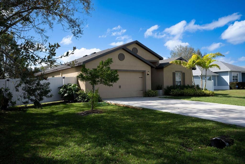 Photo of 414 SW Dahled Avenue, Port Saint Lucie, FL 34953 (MLS # R11065143)