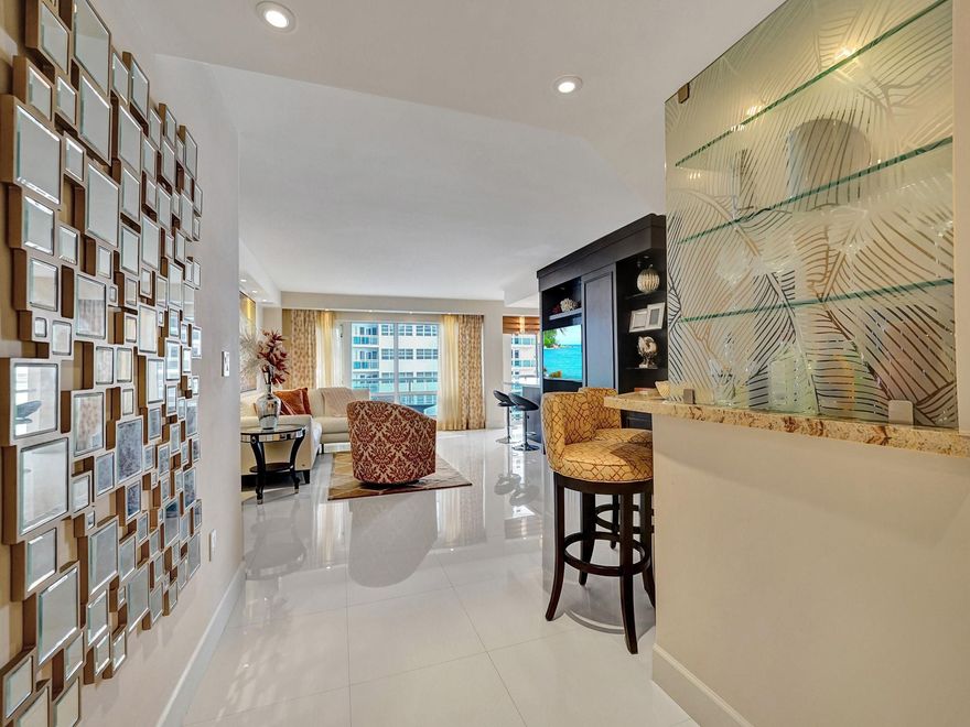 PRICE IMPROVEMENT! Beautifully renovated & fully furnished 2 bedroom/2 bath apartment in move in condition. Kitchen has Italian custom cabinetry, Bosch stainless appliances, a Bosch induction cooktop & an eat in counter area. Living room features an entertainment center; surround sound stereo system in living & dining room & master bedroom. Entry area wall was altered for a bar area. Recessed lighting & custom window treatments thru out. Both bedrooms have custom walk in closets. Both baths have beautiful frameless glass door walk in showers & custom vanities with stone countertops. Laundry room has new Bosch washer & dryer. All electronics (4 flat screen tv's) will stay. All furniture is custom & in perfect condition. Underground assigned parking; cable & internet included. Location!!!