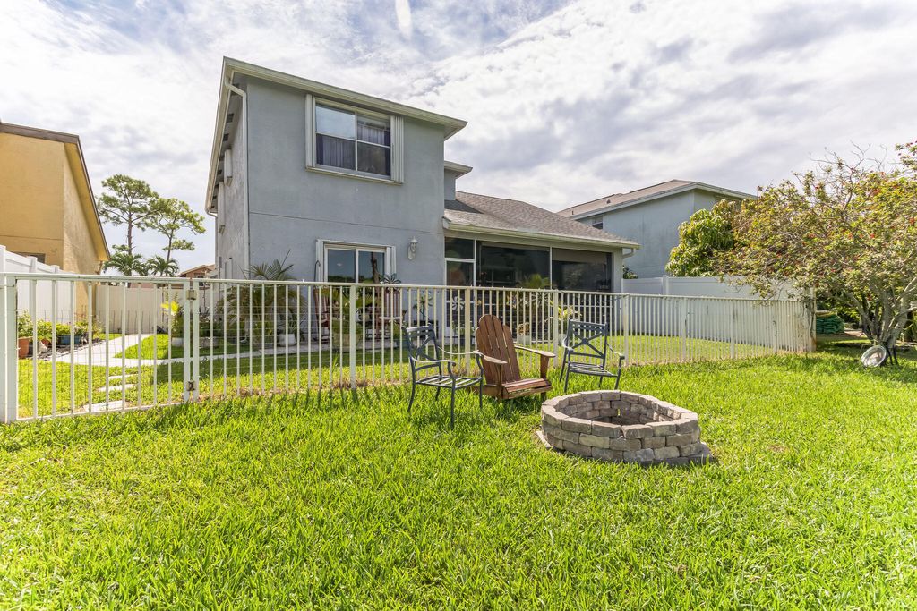Photo of 128 Heatherwood Drive, Royal Palm Beach, FL 33411 (MLS # R10913055)
