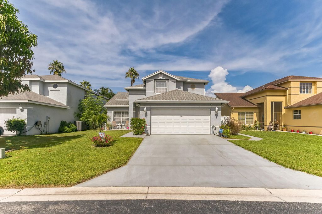 Photo of 128 Heatherwood Drive, Royal Palm Beach, FL 33411 (MLS # R10913055)