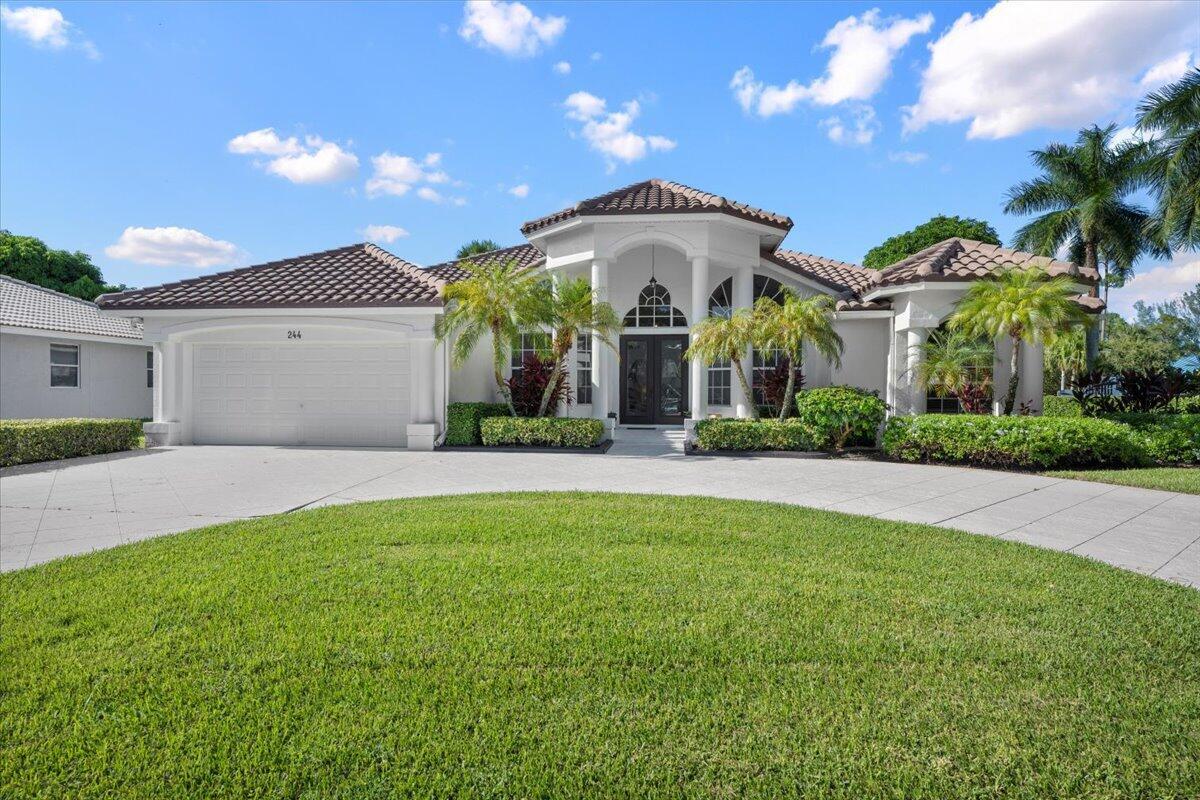 Welcome to this beautifully maintained Olivia model featuring 4 bedrooms, 3 baths, plus a bonus den/office, perfectly situated on a desirable corner lot in the Estates of Royal Palm Beach. This split floor plan offers a welcoming entryway, open living spaces, and a master suite with serene pool views and lanai access. Elegant details include tray ceilings, Corian counters, stainless appliances, and a circular driveway--plus your own fruit-bearing mango tree. Recent upgrades: roof (2019), exterior paint (2020), appliances (2020), A/C (2022). Enjoy a 24-hour manned gated community, minutes from Wellington, shopping, downtown West Palm, major highways, and PBI Airport. Move-in ready, combining comfort, style, and convenience--perfect for creating lasting family memories.