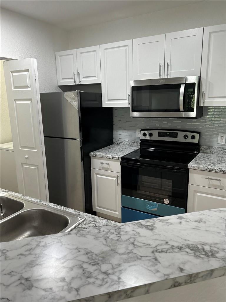Photo of 403 BELMONT Lane #403, North Lauderdale, FL 33068 (MLS # B26080196)