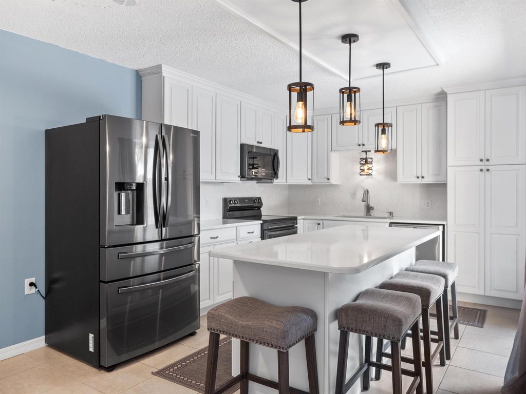 Photo of 6558 SE Windsong Lane, Stuart, FL 34997 (MLS # R11088900)