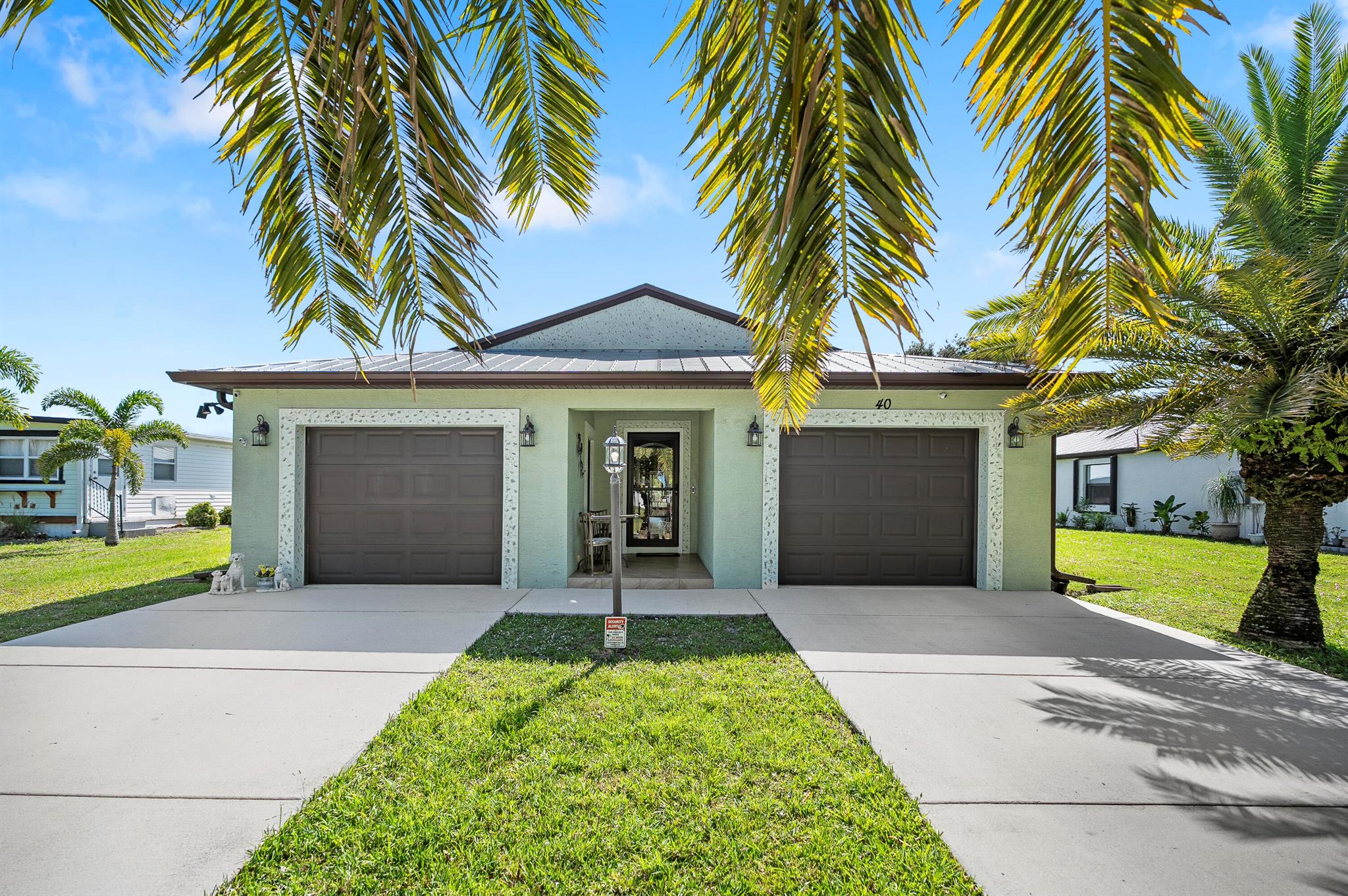 WOW! SPECTACULAR LISTING OF A CUSTOM WINDSOR MODEL WITH 40K IN UPGRADES; TO NAME A FEW: GLASS ENCLOSED PATIO WITH ROLL UP SHADES, DIAGONALLY LAID CERAMIC TILE IN THE LIVING AREAS AND VINYL PLANK FLOORING IN ALL BEDROOMS INCLUDING WALK IN MASTER BEDROOM CLOSET, PLANTATION SHUTTERS, UPGRADED STAINLESS STEEL APPLIANCES, COMPLETE ACCORDION SHUTTERS. THE LOCATION OF HOME IS ABSOLUTELY ONE OF A KIND FRONT ENTRY WITH A MAGNIFICENT VIEW OF GOLF COURSE WITHIN WALKING DISTANCE TO THE CLUBHOUSE, VAST EXPANSE OF LAND FROM PATIO OVERLOOKING WATER VIEW. ENJOY RESORT LIFESTYLE LIVING AS ALL AMENITIES ARE INCLUDED. MOVE IN READY, FURNITURE NEGOTIABLE. DON'T MISS OUT ON THIS VALUE.52 & older community