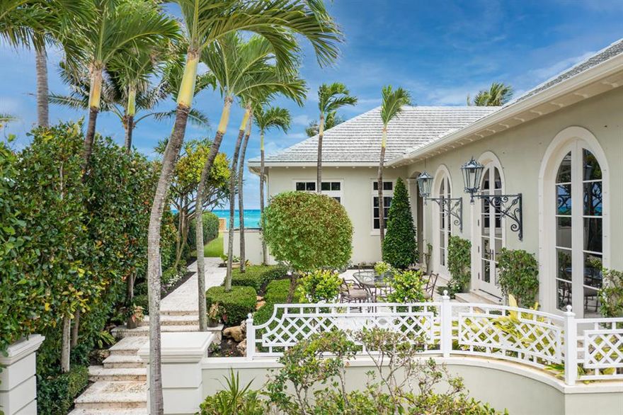 Architectural detail and endless ocean views are the hallmarks of this exceptional Mizner inspired oceanfront estate. This inviting home is located on one of the finest private beaches in all of South Florida. Constructed with the highest level of fit and finish and attention to detail, every room is well thought out. River-recovered Cypress wood employed by Mizner in the Cloister Resort and utilized in this home, gives a nod to historical Floridian architecture and adds warmth and texture to this sophisticated beachfront estate. The stunning great room resides below a vaulted cypress ceiling while French doors draw your eye to the dazzling turquoise blue ocean water.  This impressive sweeping space includes a fabulous dining area for large gatherings and an open concept living room perfect for entertaining.  The well-appointed kitchen has everything you need. Grab a coffee and head to the beachfront terrace for the perfect morning paradise. 

A grand arched hallway offers a striking transition from the foyer to the great room and beyond.  Moving through this transitional space, you will discover a beautifully appointed living room/loggia, overlooking an outdoor terrace that provides an enchanting space for evening cocktails or intimate dinner parties.  The stately wood paneled office perfectly situated for privacy is a tranquil setting for work or pleasure.   

The Travertine marble floors complement the generous use of custom millwork throughout the entire home. Grand fourteen-foot ceilings, oversized windows and French doors maximize natural light and stunning views of the sparkling azure blue water.   The serene light-filled master suite captures the sunrise over the ocean with Eastern facing floor to ceiling windows. This suite boasts custom his and her closets and a large master bath. 

Tucked away on the upper level are two gracious bedroom suites with ample closets and spacious bathrooms. An inviting balcony overlooking a private courtyard provides another serene landscape. 


The stunning and spacious cabana is fully clad in Pecky Cypress, featuring a cathedral ceiling and a seamlessly integrated Cypress kitchen. This charming room overlooks a covered loggia outfitted with a summer kitchen ideal for casual get togethers.  An oversized swimming pool is perfectly positioned to take advantage of all day sun.  Two lovely bedrooms with en-suite baths and a bunk room will delight visiting family and guests. 

The property is located in one of the most exclusive private communities in Florida which offers golf, tennis, a state-of-the-art fitness facility, a private beach and first-class security.