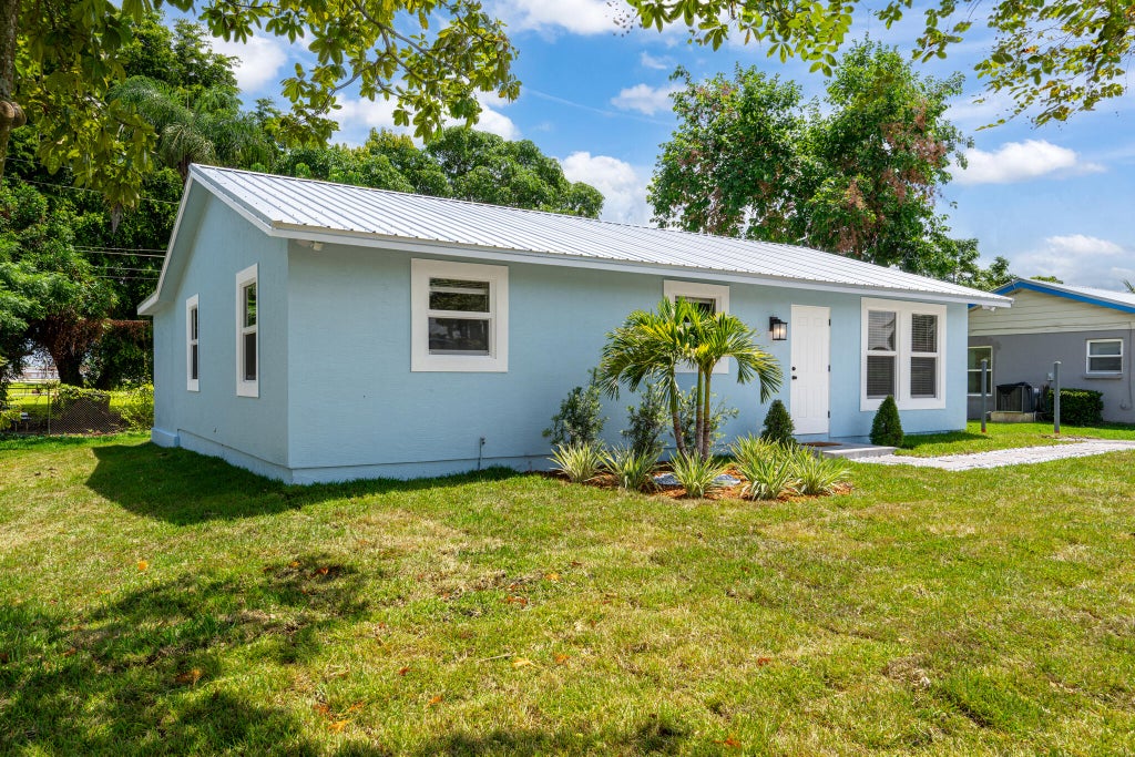 Photo of 625 NW 14TH Street, Belle Glade, FL 33430 (MLS # B26069438)