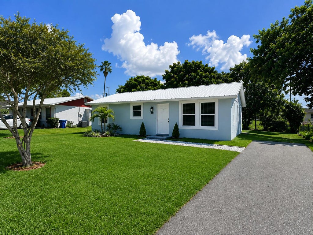 Photo of 625 NW 14TH Street, Belle Glade, FL 33430 (MLS # B26069438)