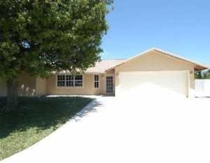 THIS HOME IS AN ABSOLUTELY 1ST CLASS CUSTOM REBUILD! LOCATED IN ONE OF THE MOST BEAUTIFUL AREAS OF PORT ST. LUCIE. HOME IS ON AN OVERSIZED CORNER LOT, SOUTH OF TIFFANY & EAST OF US1, WITH A-RATED SCHOOLS LOCATED JUST BLOCKS AWAY. HOME FEATURES VAULTED CEILINGS, ROUNDED CORNERS, SKYLIGHTS IN FAMILY ROOM AND ABOVE M/B JACUZZI TUB, TILE FLOORS, CUSTOM DESIGNED KITCHEN, SPA LIKE BATHROOMS, ALL WITH MAPLE CABINETS & GRANITE COUNTERTOPS. NEW STAINLESS STEEL APPLIANCES W/DOUBLE OVEN IN KITCHEN. OPEN FLOOR PLAN IS SPLIT W/LARGE GREAT ROOM & FIREPLACE, SPACIOUS BEDROOMS, LOTS OF CLOSET SPACE. 3 SETS OF FRENCH DOORS OPEN TO A FABULOUS FLORIDA ROOM WITH A/C OVERLOOKING POOL WITH LARGE YARD THAT IS COMPLETELY FENCED.