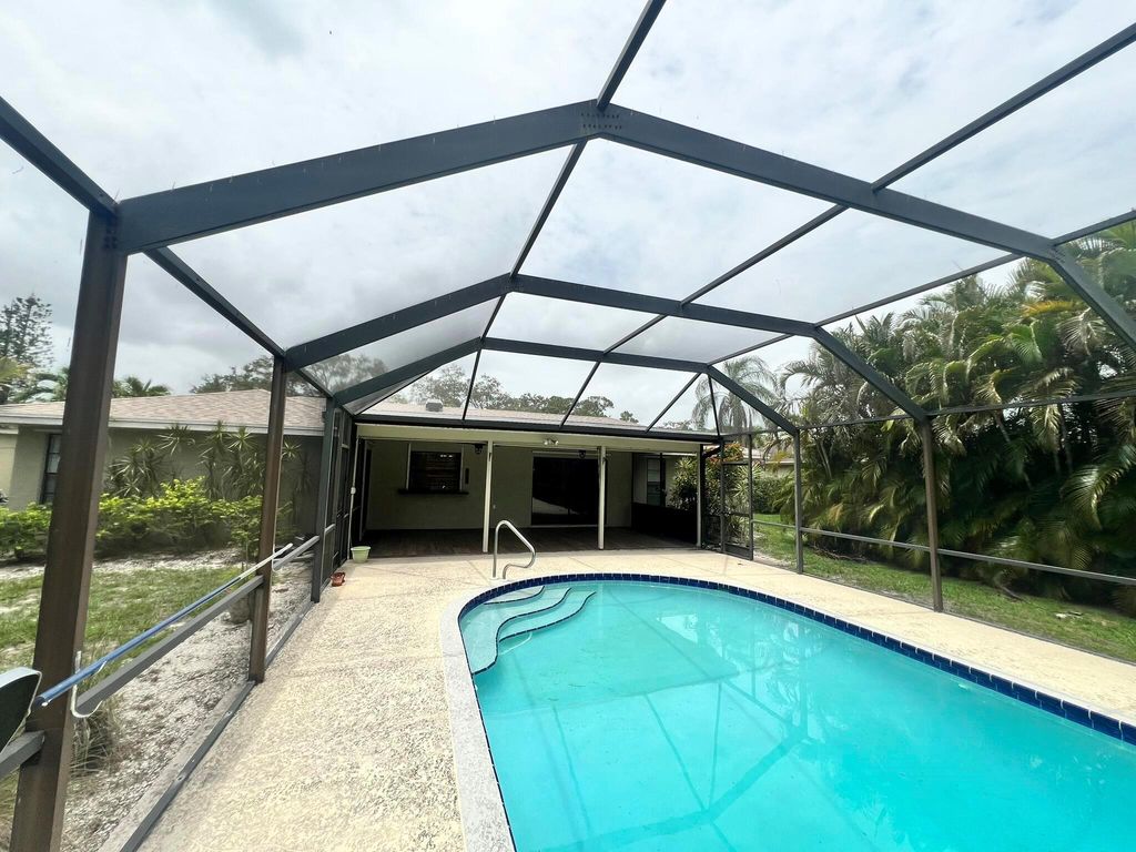 Photo of 1240 SE Palm Beach Road, Port Saint Lucie, FL 34952 (MLS # R11101732)