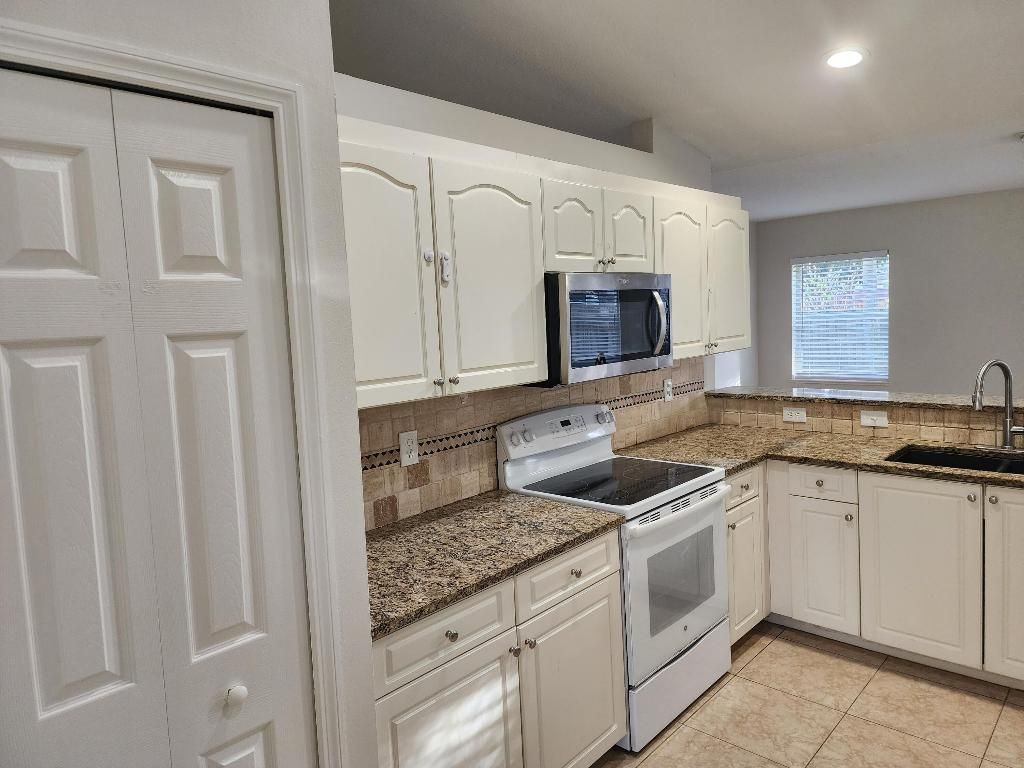 Photo of 1516 SW Escobar Lane, Port Saint Lucie, FL 34953 (MLS # R11157950)