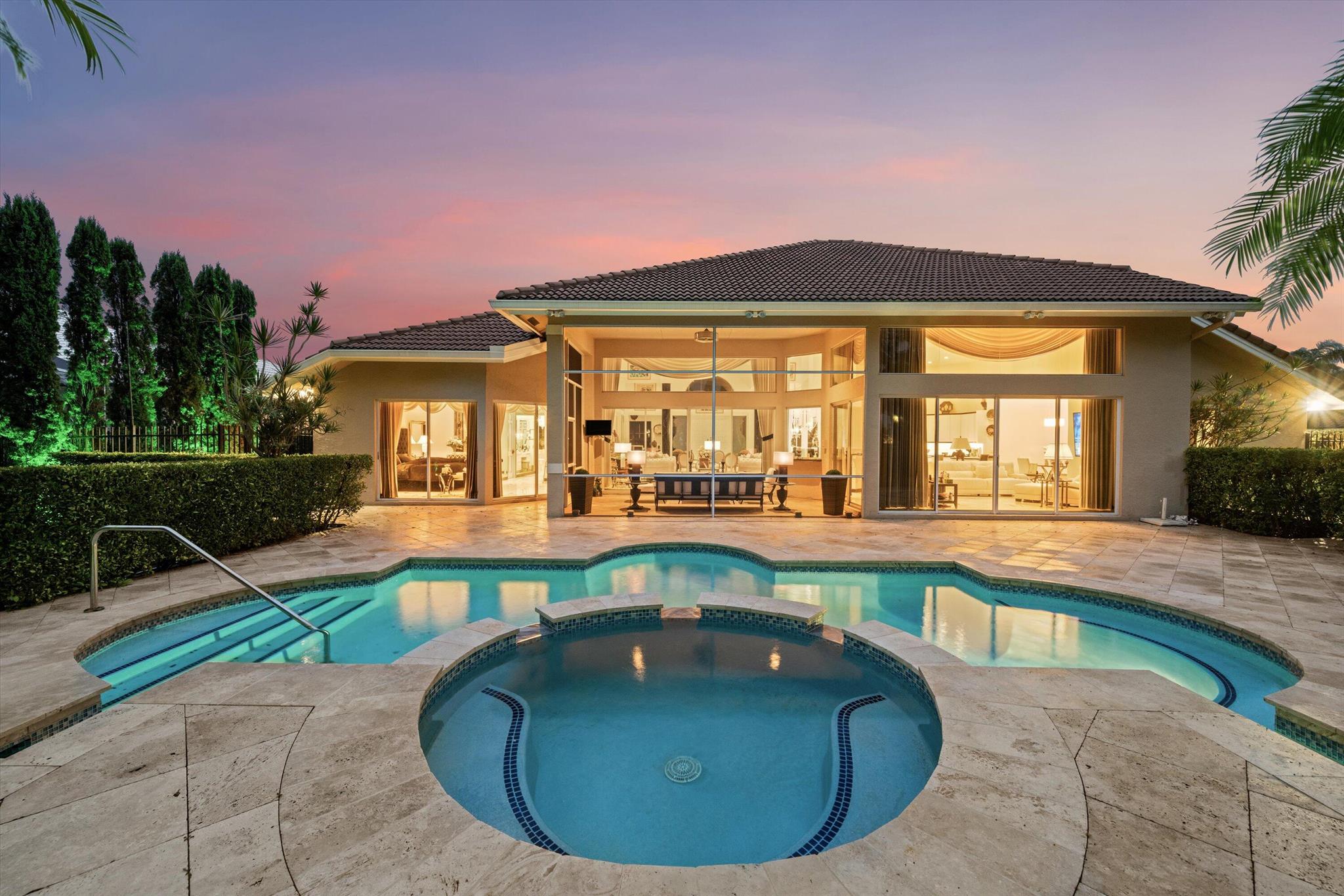 Elegantly renovated Breakers West Estate home offers timeless luxury with this 3-Bedroom + Office + Flex Room, 3.5-Baths and full 3-Car Garage in 3,489 sq ft of air-conditioned living space (4,622 total sq ft). This home is a rare blend of elegance and privacy in the prestigious, guard-gated community of Breakers West. Positioned on a lush, 1/2 acre fenced lot overlooking Mayacoo Lakes Golf Course's manicured fairway, the cypress tree-lined driveway and motor court have been updated to marble stone pavers and extend into the oversized 3 car garage(w/hurricane impact doors). Once inside you'll be impressed by the Living and Dining Room with its 16 ft smooth ceilings and 8ft sliding doors with 4 ft transom windows above in both the Living and Family Rooms offer a picture perfect view