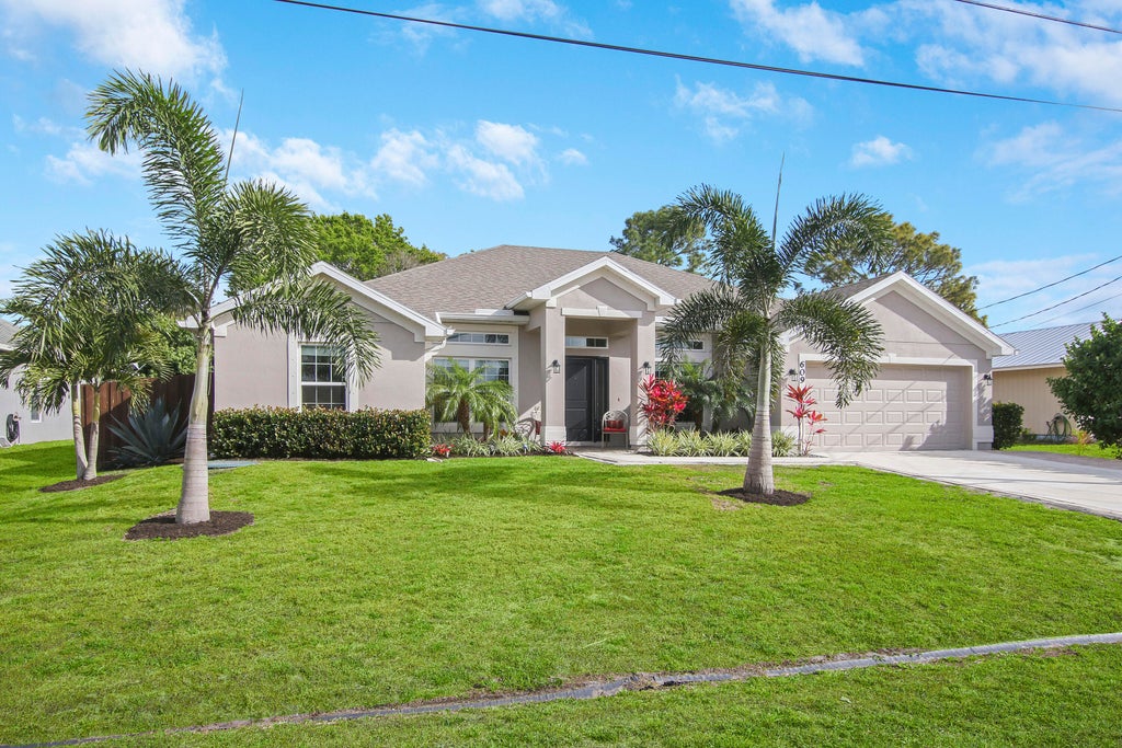 Photo of 609 SW Hillsboro Circle, Port Saint Lucie, FL 34953 (MLS # R10778036)