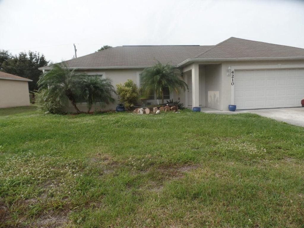 Photo of 4210 SW Utterback Street, Port Saint Lucie, FL 34953 (MLS # R11133394)