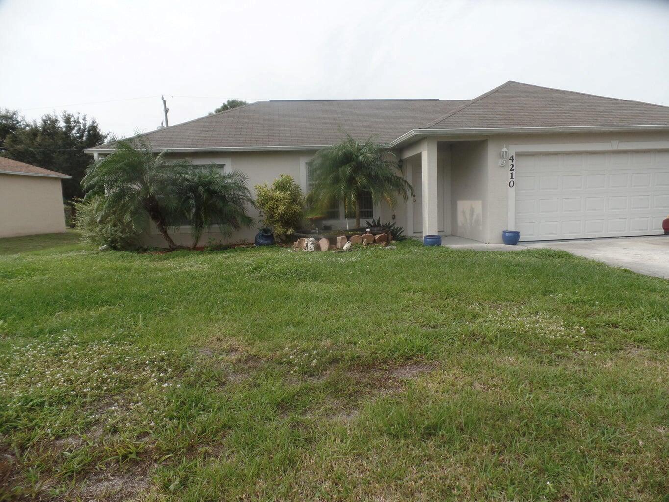 Fresh pained 3 bedroom, two Bath, two car garage. Tiled throughout. Screened patio with large backyard, fruit trees, minutes to I95, shopping and schools.