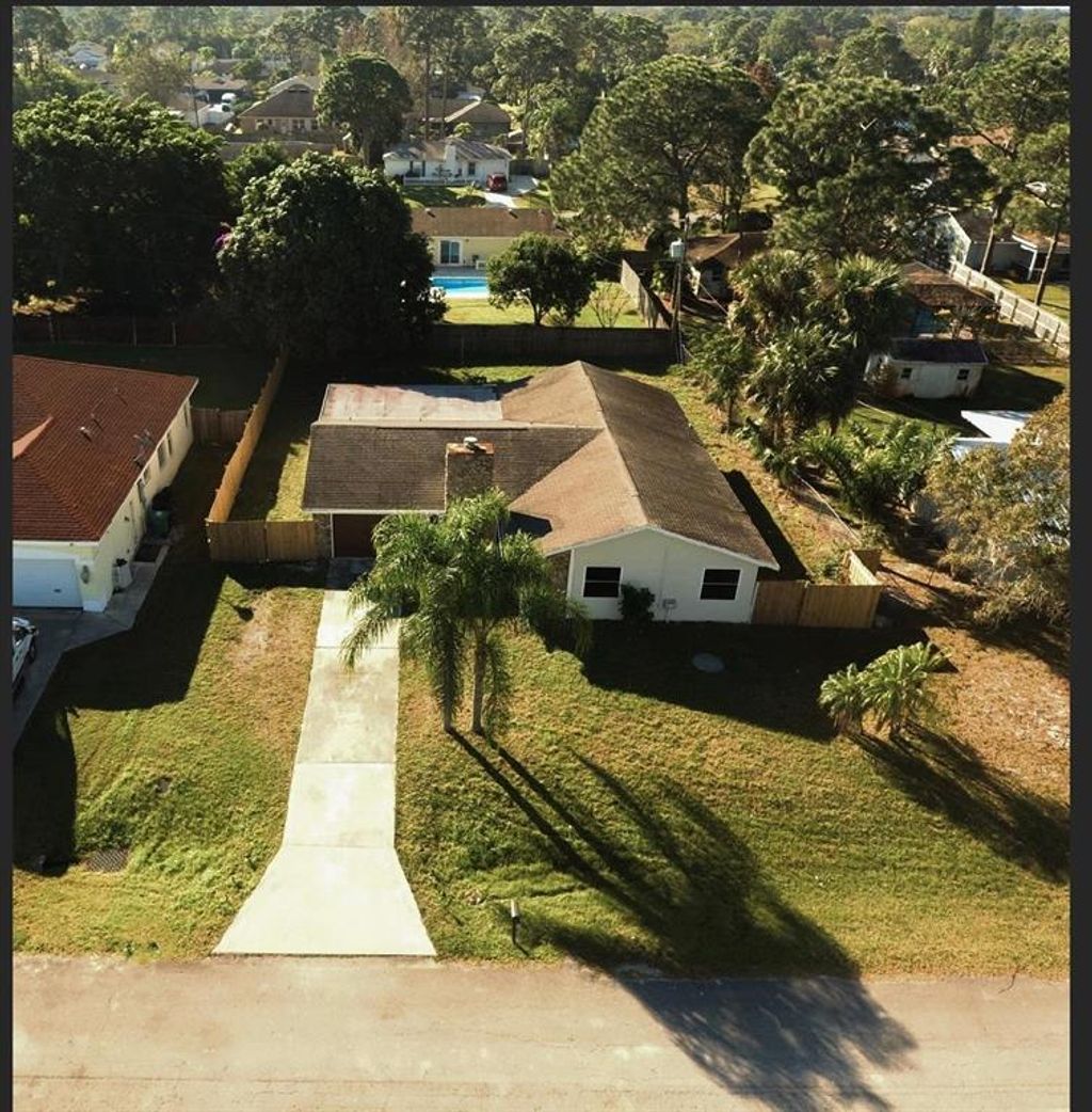 Photo of 566 NW Sherbrooke Avenue, Port Saint Lucie, FL 34983 (MLS # R10695850)