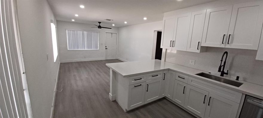 Excellent location totally renovated, new flooring, new kitchen cabinets, new bathroom, new stainless steel appliances,new lightening, central A/C ready to move in, WASHER & DRYER, RENT INCLUDES UTILITIES (WATER,ELECTRIC & LANDSCAPING)