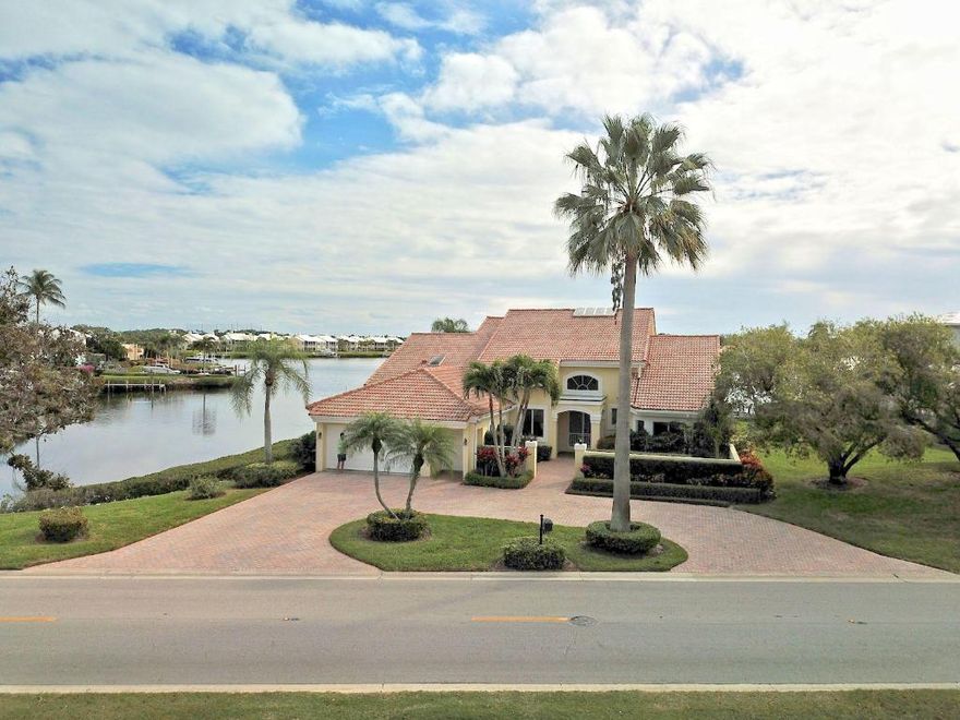 Come build your dream home or update this patio home on a Spectacular oversized lot in prestigious Admiral's Cove.  This property offers breathtaking views with water along the north and east side of the property.  The lot is 0.48 acres and has a neighbor on the south side of the property only.  Pull your boat right up to your private dock.  Full Golf Membership Required.