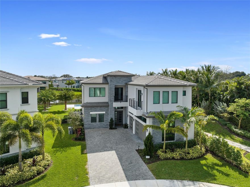 Welcome to the most luxurious gated community, Boca Bridges! This stunning two story home features 5 spacious ensuite bedrooms with upgraded granite countertops including a master suite with dual walk-in closets, covered verandah overlooking the lake, and a gourmet kitchen with quartz countertops and 3 car garage. Entertain with a formal dining room, great room with wet bar, game room, loft, office, and media room. Step outside to your own private oasis, where the serene lake view serves as a picturesque backdrop to your saltwater pool, mini golf area, and outdoor summer kitchen. Enjoy access to the communities world class amenities, a 27,000+ SqFt clubhouse with onsite restaurant, two pools, gym, + more!