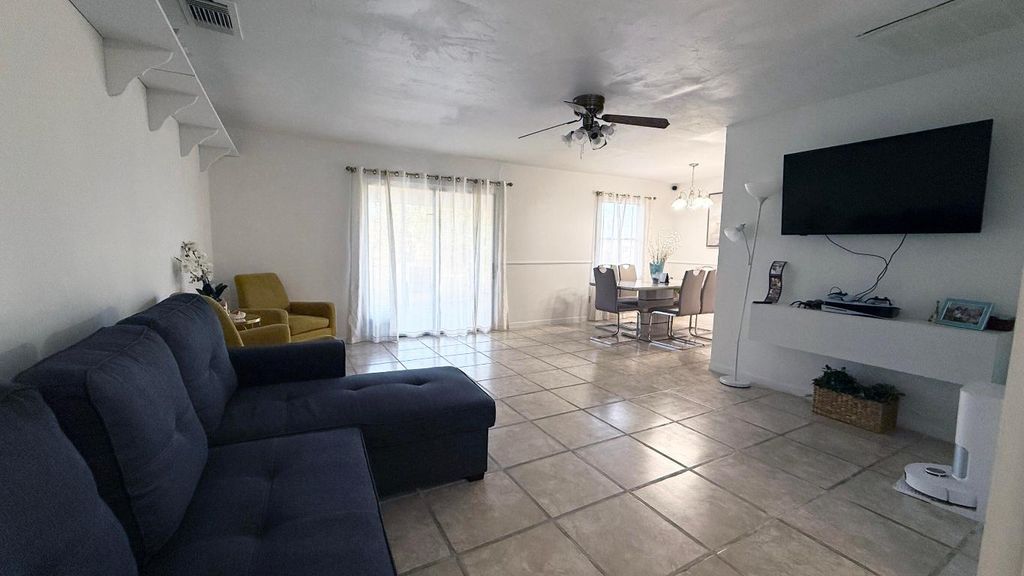 Photo of 1415 SE Port St Lucie Boulevard, Port Saint Lucie, FL 34952 (MLS # R11154565)